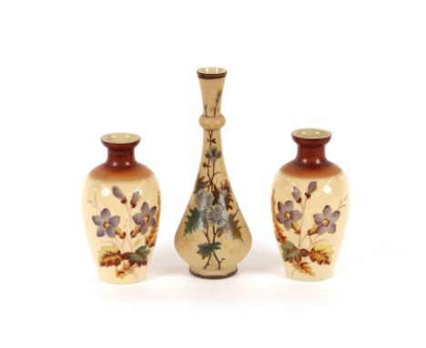 A pair of Victorian opaque glass vases, with enamel decoration of flowers; and another similar