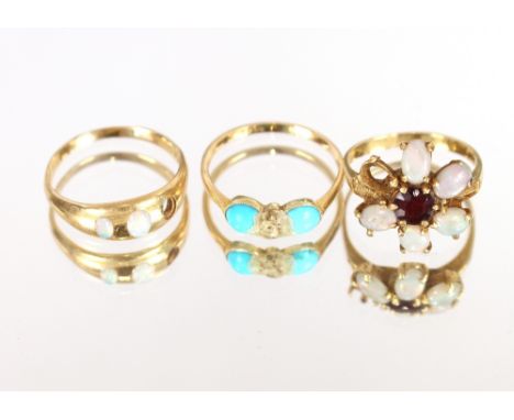 An 18ct gold ring, set opals (one stone missing); another set turquoise, AF; and an 18ct gold opal and ruby set cluster ring 