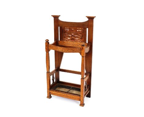An oak Arts &amp; Crafts design stick stand, with floral embossed copper plaque, 59cm wide x 110cm high