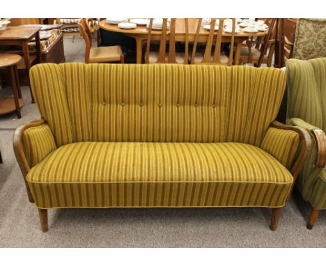 A 1940's Danish beech and upholstered sofa, having shaped arms raised on rounded tapering supports