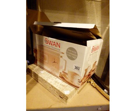 Boxed Swan compact teasmade and a canteen of cutlery