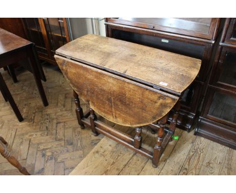 A 19th Century oak drop leaf gate leg table