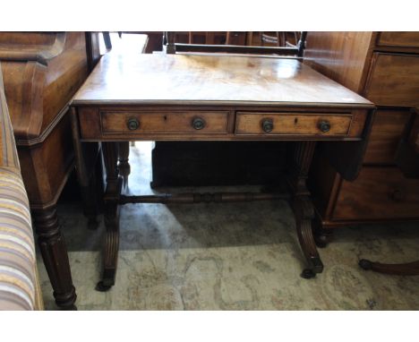 A Regency mahogany two drawer sofa table on original castors