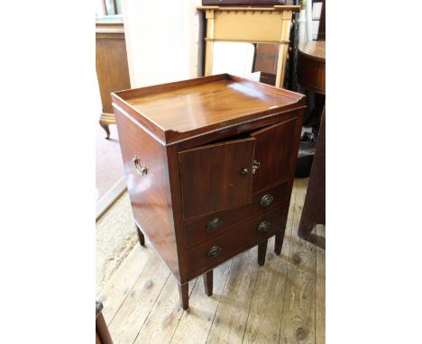A George III mahogany commode converted into a small cupboard
