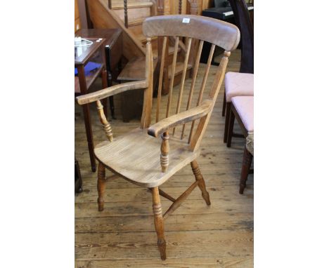 A mid Victorian beech and elm stick back armchair