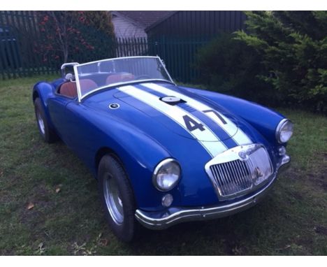 A 1959 LHD MG A roadster, US registered, blue with racing white stripes. The left hand drive MG A roadster has been heavily m