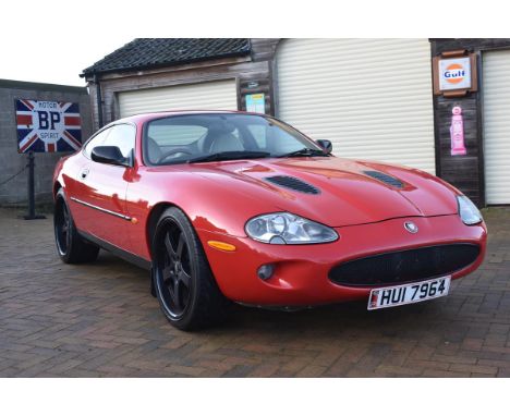 A 1998 Jaguar XKR coupé, registration number HUI 7964, chassis number SAJJGAEF3AR026725, engine number CC9804021620, red. Lau