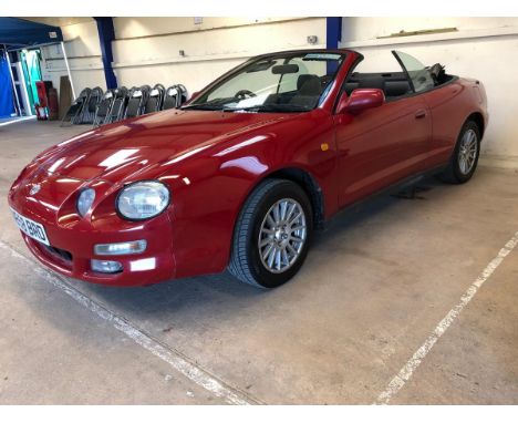 A 1996 Toyota Celica convertible, registration number N658 BRD, red. This rare convertible was imported in 1999 and has had a