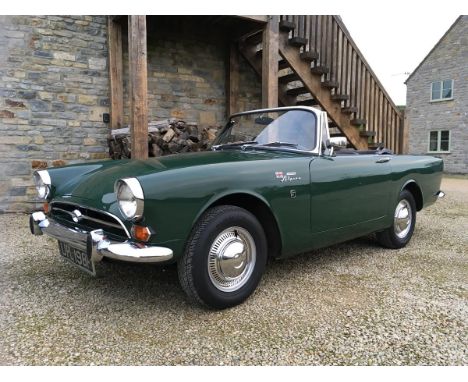 A 1968 Sunbeam Alpine Series V, registration number UPL 198F, Holly green.  The Alpine was firmly aimed at the North American