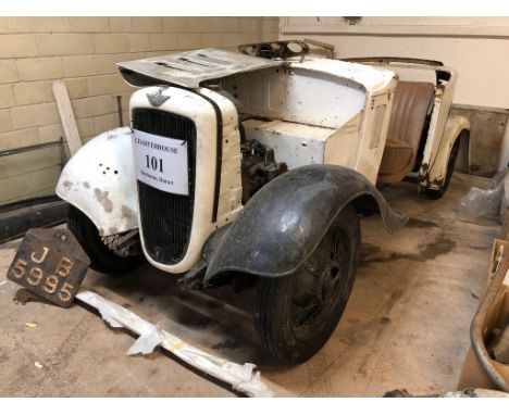 A 1935 Austin 10/4 tourer restoration project, registration number JB 5995, grey. The Austin tourer has been stripped and has