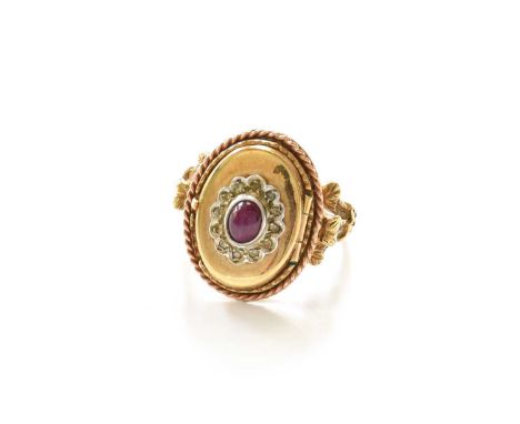 A 9 Carat Gold Cabochon Ruby and Diamond Cluster Locket Ring, the central cluster laid upon a locket, within a rope twist bor