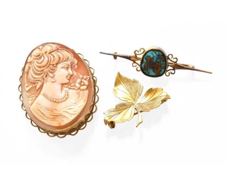 A Turquoise Matrix Brooch, stamped '9CT', length 6.0cm; A 9 Carat Gold Leaf Motif Brooch, length 3.7cm; and A Cameo Brooch, i