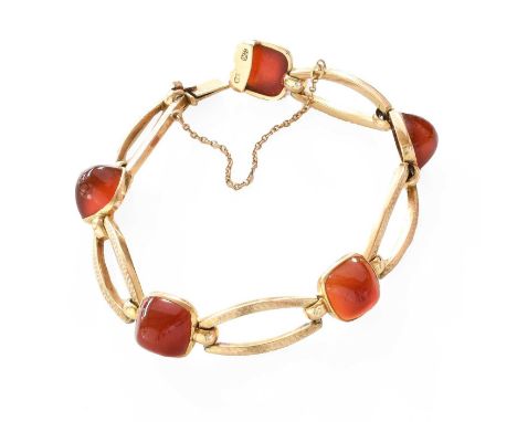 A Carnelian Bracelet, the sugarloaf carnelian cabochons in yellow rubbed over settings, spaced by openwork textured links, le