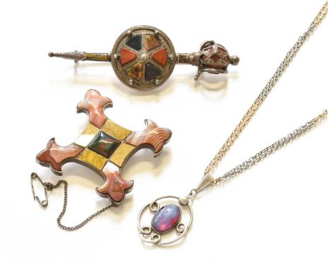 A Charles Horner Pendant on Chain, pendant length 3.8cm, chain length 35cm; and Two Scottish Hardstone Brooches, of varying d