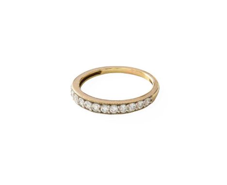 A 9 Carat Gold Diamond Half Hoop Ring, twelve round brilliant cut diamonds in white claw settings, to a yellow plain polished