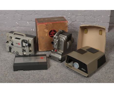 A boxed Bolex Paillard projector, along with and Aldis projector and a Eumig Mark S projector.  