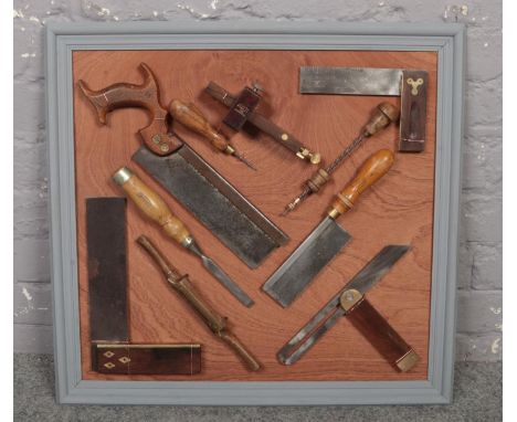 A framed display of vintage tools, to include Joseph Marples.  