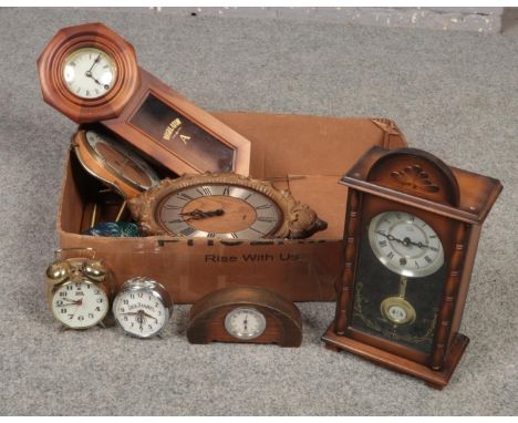 A box of clocks, RJM 15 day cased mantel clock, Jack Daniels alarm clock, Regulator A wall clock examples  