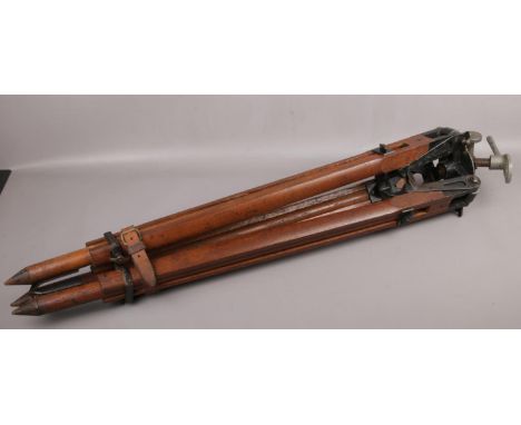 A WWII theodolite tripod stand baring the broad arrow mark.  