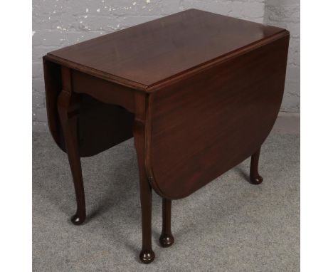 A mahogany gate leg dining table.  