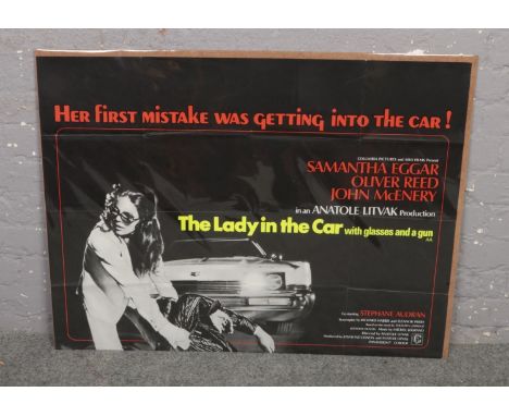 An original film poster for The Lady In The Car With Glasses And A Gun.  