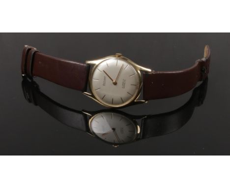 A gentleman's 9ct gold cased manual Rotary wristwatch in slip profile case. With satin dial having baton markers, 34mm wide. 