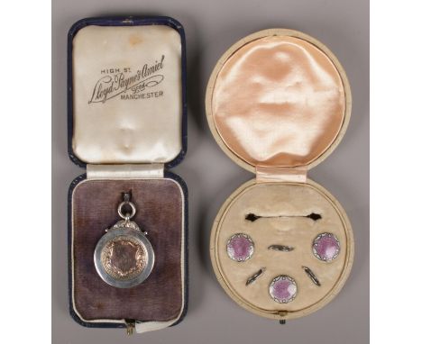 A part set of George V silver and guilloché enamel dress buttons by J Aitkin &amp; Son, each button with white and violet ena