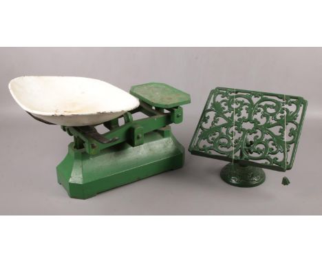 A set of kitchen scales, along with an iron recipe stand.  
