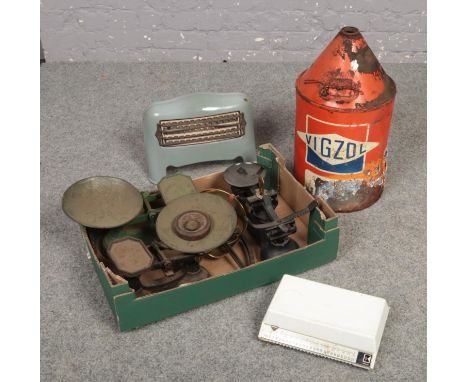 A vintage Vigzol oil drum along with a box of scales and a small enamel heater.  