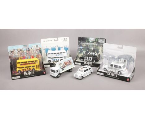 A collection of The Beatles diecast model vehicles, mainly boxed.  