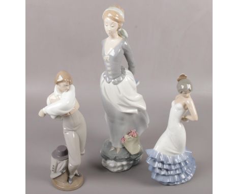 A large Lladro figure of young girl with flower basket (37cm tall) along with two Nao figures.  