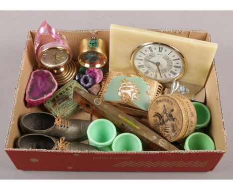 A box of collectables. Including a Swiza malachite effect bedside alarm clock, Elvicta sprit level, Husky lighter and Parker 