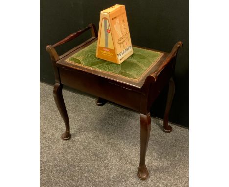 An Edwardian painted piano stool, upholstered top, tapering rails, cabriole legs, a metronome 