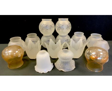 A set of eight frosted globular glass lamp shades, floral decoration, wavy rims, approx 14cm high, 13cm diameter;  others con