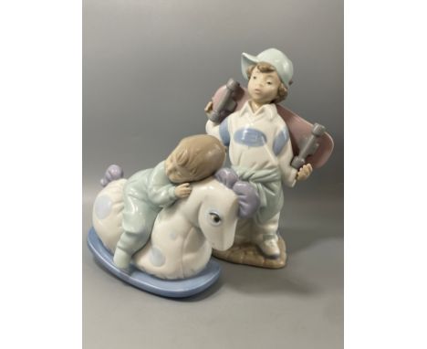 2x Nao by Lladro figures to include boy with skateboard and boy on rocking horse 