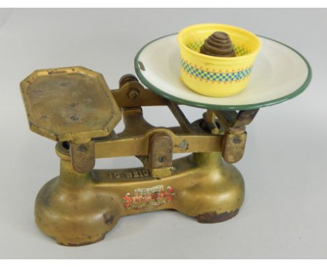 A set of J & J Siddons Ltd scales, in painted metal, with enamelled tray, cast iron weights etC