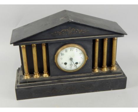 A late 19thC French portico shaped black slate clock, with six gilt metal columns and enamel dial, 43cm wide