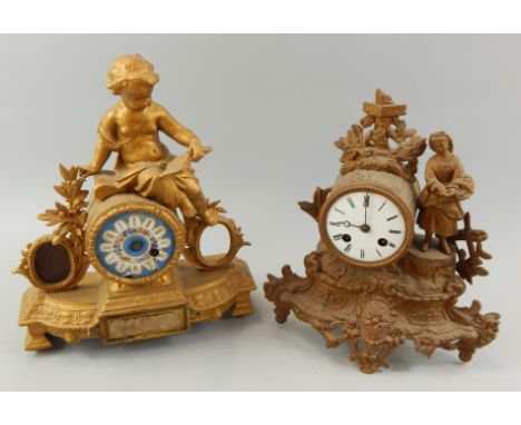 Two late 19thC French gilt metal figural mantel clocks, each decorated with flowers, one with a porcelain dial (AF), the othe