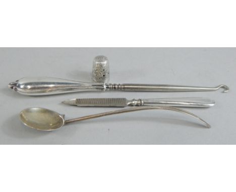 A collection of small silver, to include a thimble, a small Arts and Crafts style spoon, button hook etC