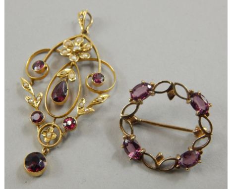 An Art Nouveau amethyst and seed pearl pendant, in the design of flowers and leaves, yellow metal mount, marked 9ct, and anot