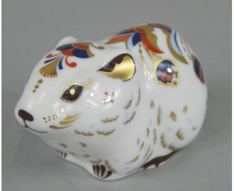 A Royal Crown Derby porcelain bank vole, printed mark in red to underside, gold button, boxed