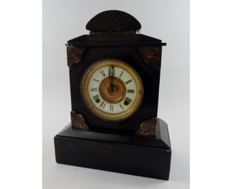 A late 19thC French black slate and variegated marble mantel clock, with a white enamelled and gilt metal dial, arched case o