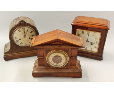 Three various mantel clocks, to include an Art Deco style example in a mahogany case, a German clock with domed top and anoth