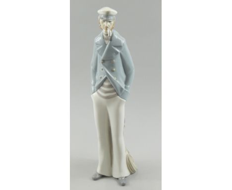 A Lladro porcelain figure of an old sailor smoking a pipe, 37cm high