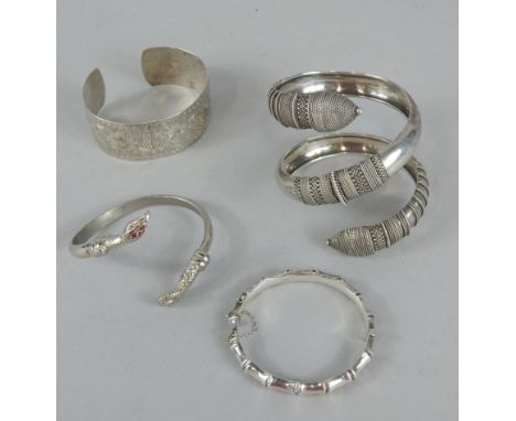 Various bangles, to include Middle Eastern design bangle, serpent bangle, etc, some silver. 