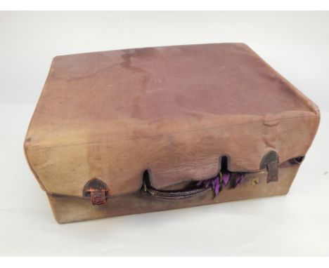 An early 20thC black leather dressing case, containing various glass jars with silver mounts, manicure set, etc, formerly the