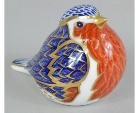 A Royal Crown Derby porcelain robin, printed mark to underside and silver button