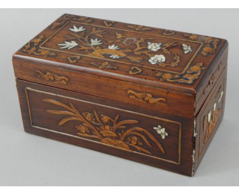 A Chinese hardwood box, carved overall with flowers etC and inlaid in mother of pearl, 22cm wide