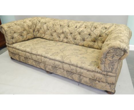 A large Victorian Chesterfield sofa, later upholstered in floral fabric, on bun feet, 230cm wide.rovenance: Thurlby Hall, Lin