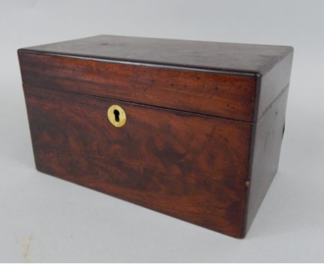 An early 19thC mahogany tea caddy, of rectangular form, enclosing two later lidded compartments